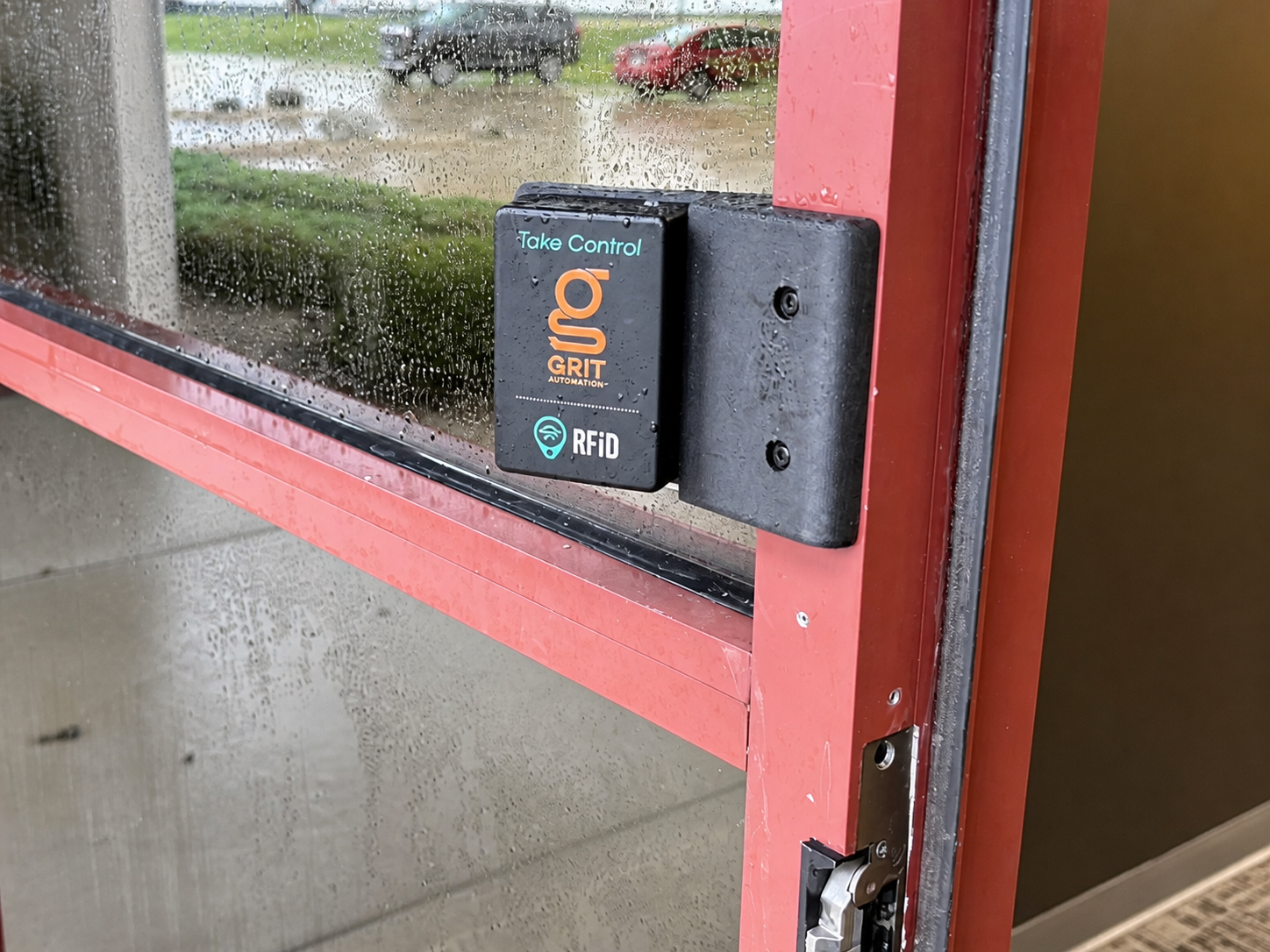 GRIT RFiD reader installed beside an exterior access-controlled door